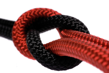 black and red ropes tighed in reef knot.
