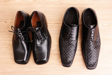 Man's shoes on wooden texture