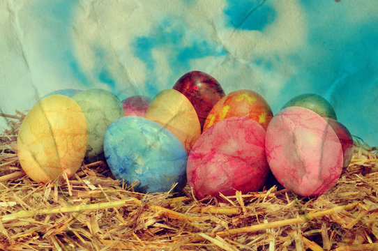a vintage picture of some easter eggs on a nest