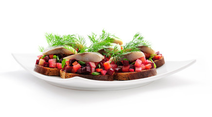 Sandwiches with rye bread, herring and vegetables