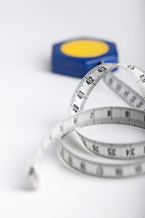 tape measure rolled on white background
