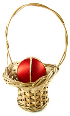 Easter egg in a wattled basket