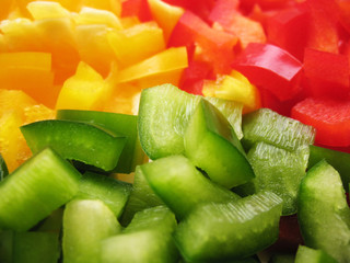 Yellow, red and green peppers Bulgarian. Slicing. Cubes