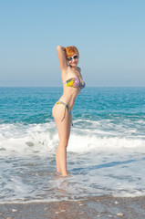 Fototapeta na wymiar woman in swimwear on the beach .