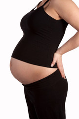 Profile of a pregnant woman's bare stomach