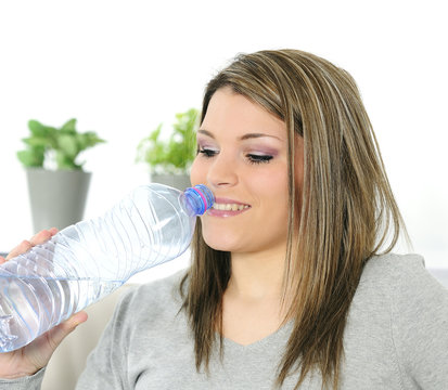 young beautiful woman with a bottle of water