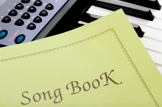 piano keyboard with song book