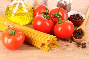 Pasta spaghetti with tomatoes, olive oil, peper  and basil on a