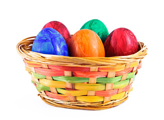 Painted eggs in a basket.