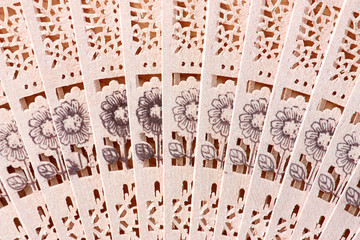 Macro shot of a fan with floral pattern © zest_marina