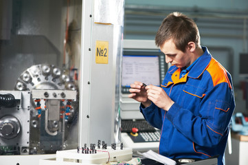 worker examining detail