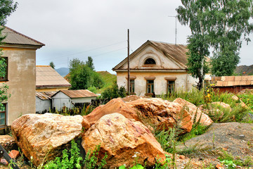 Big boulders near a small house