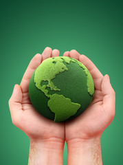 holding a green earth