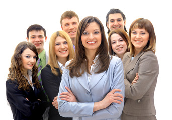 Happy young business woman standing in front of her team