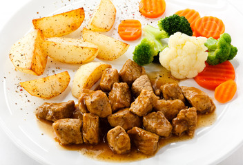 Goulash with roasted potatoes and vegetables