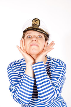 Middle aged female dressed as sailor in striped shirt