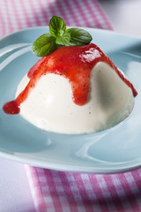 Panna cotta with strawberries and mint sauce
