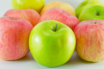 Green and red apples isolated on white background