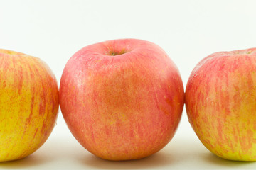 Three red apples isolated on white background