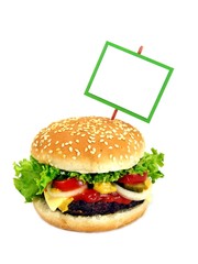A cheeseburger with a green framed blank sign