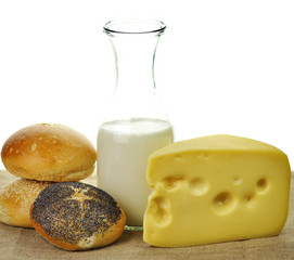 milk bottle , cheese and fresh rolls