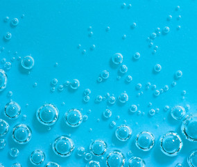 Blue abstract water with bubbles. Macro. Closeup. Horizontal.