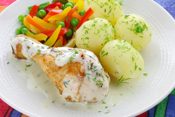 Chicken leg with vegetables and sauce