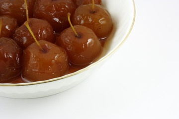 Conserved paradise apples in a plate