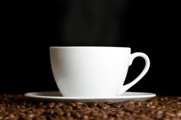 White cup with hot coffee
