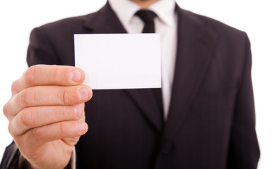 Business man handing a blank business card over white background