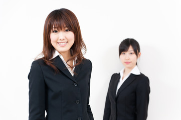 two asian businesswomen standing