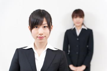 two asian businesswomen standing