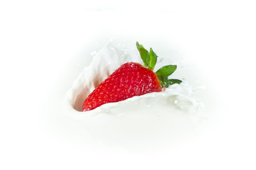 strawberry splashing into milk