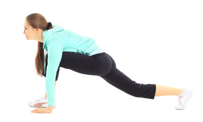 Obraz premium The beautiful young woman plays sports on a white