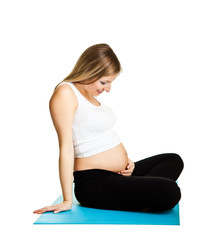 Pregnant woman fitness isolated on white