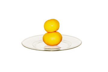 two tangerines on plate isolated on white