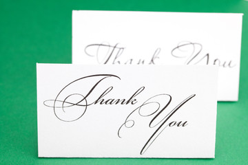 card signed thank you on green background