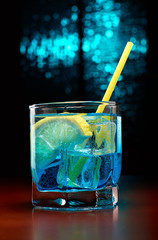 Blue cocktail with lemon