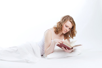 Fototapeta premium young beautiful girl reads book
