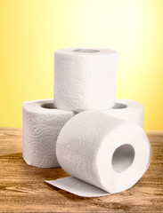 Toilet pape on yellow background