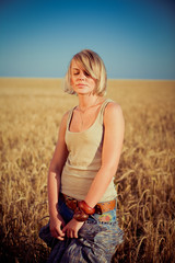 Image of young woman on wheat field