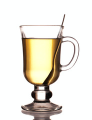 Glass of green tea with spoon