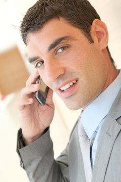 Portrait of salesman talking on the phone