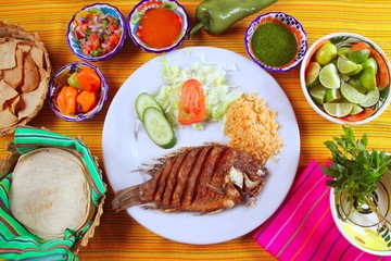 fried mojarra tilapia fish Mexico style with chili sauce