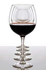 red wine glass and empty glasses