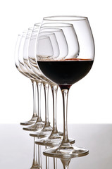 red wine glass and empty glasses - 31412424