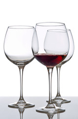 red wine glass and empty glasses