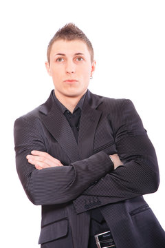 business man standing with arms folded