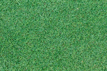 Fototapeta premium Background texture with fake grass in a public children playgrou