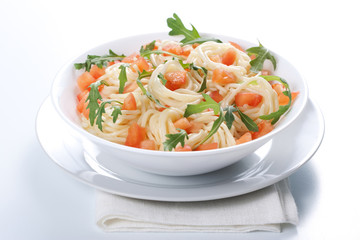 Pasta with tomato and rucola